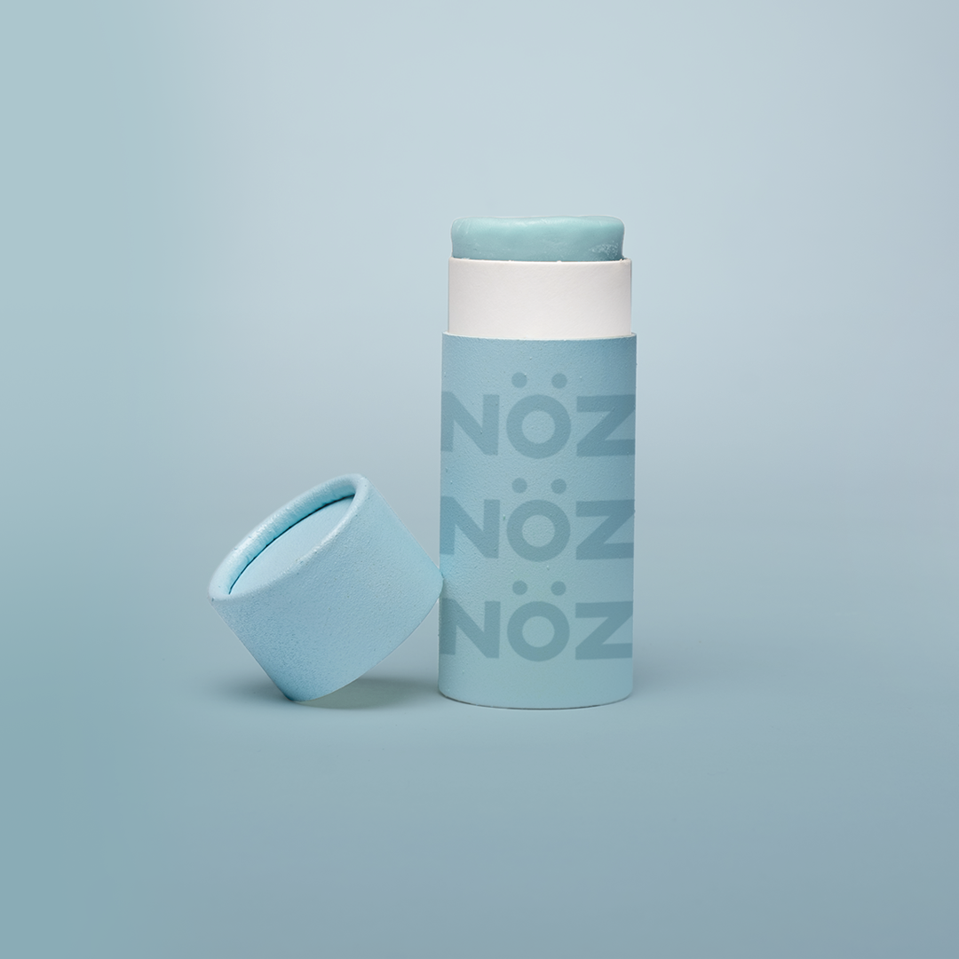 Light Blue Nöz sunscreen stick product with cap off