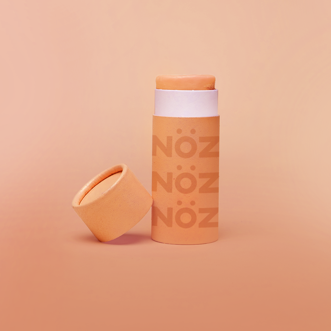 Orange Nöz sunscreen stick with cap off 