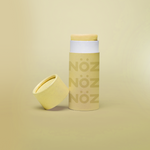 Load image into Gallery viewer, Yellow Nöz sunscreen stick product with cap off
